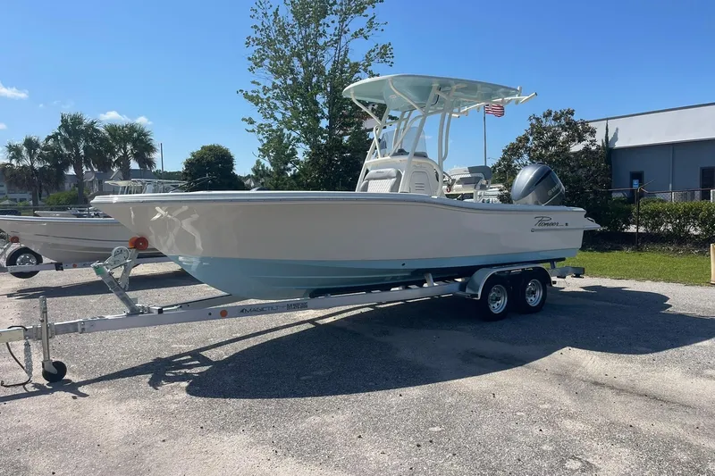 The Image of 2026 Pioneer 220 Bay Sport boat on trailer, parked outdoors under clear sky. - 10