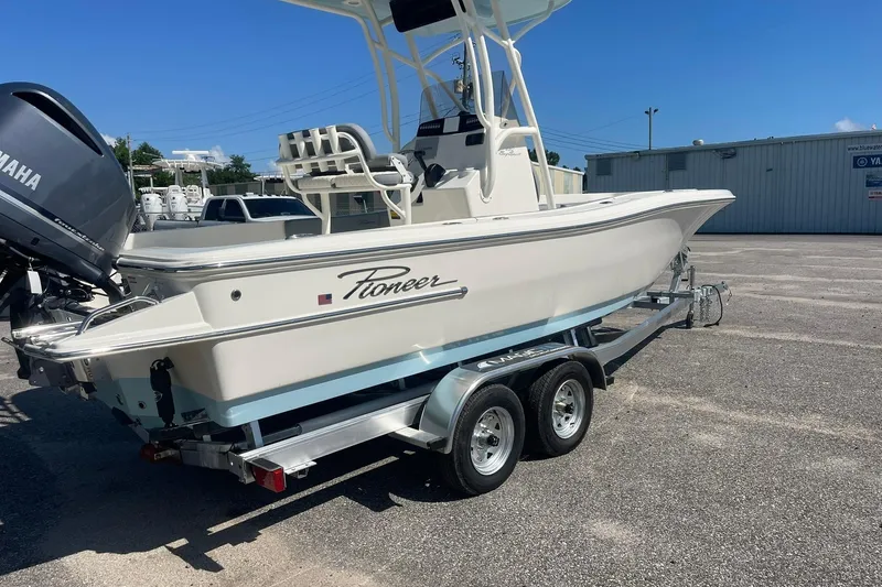Slide: The Image of 2026 Pioneer 220 Bay Sport boat on trailer, featuring Yamaha outboard motor. - 12