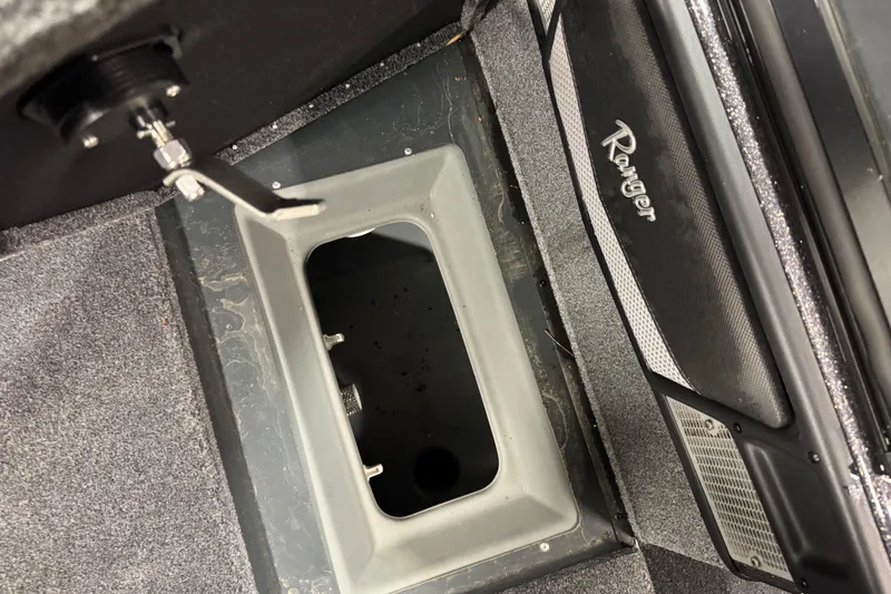 Slide: The Image of 2024 Ranger VX1888 WT boat storage compartment with latch and Ranger branding. - 15