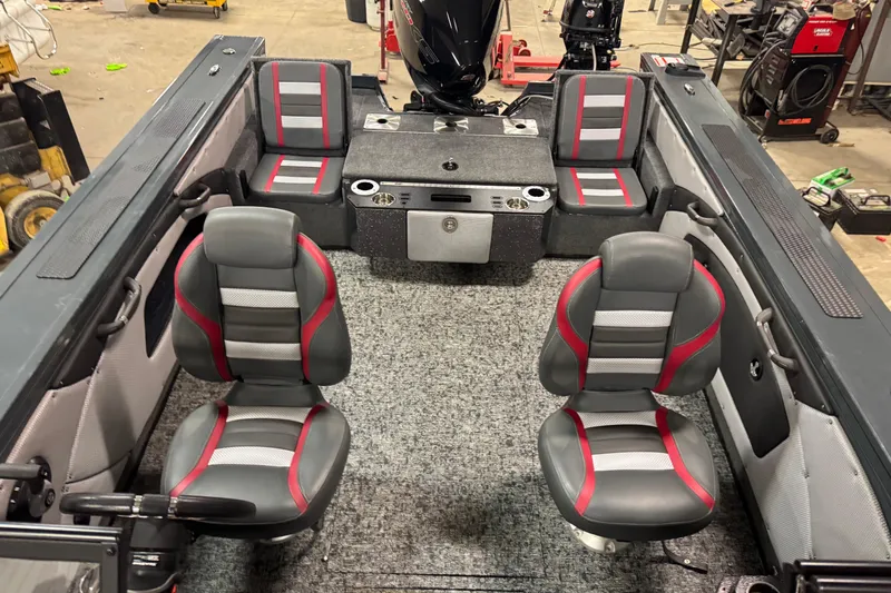 Slide: The Image of 2024 Ranger VX1888 WT boat interior with gray and red seating, spacious layout. - 17