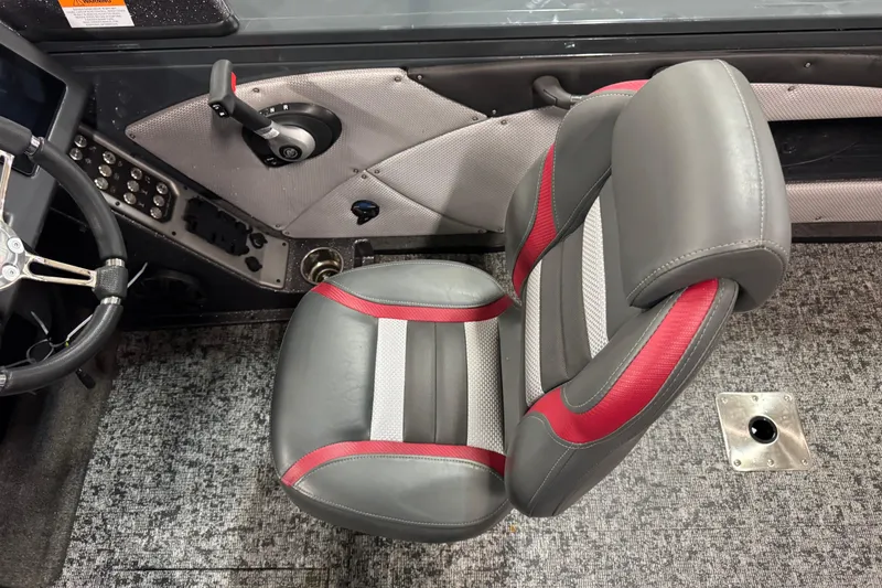 Slide: The Image of 2024 Ranger VX1888 WT boat interior with gray and red seat, steering wheel, and controls. - 6