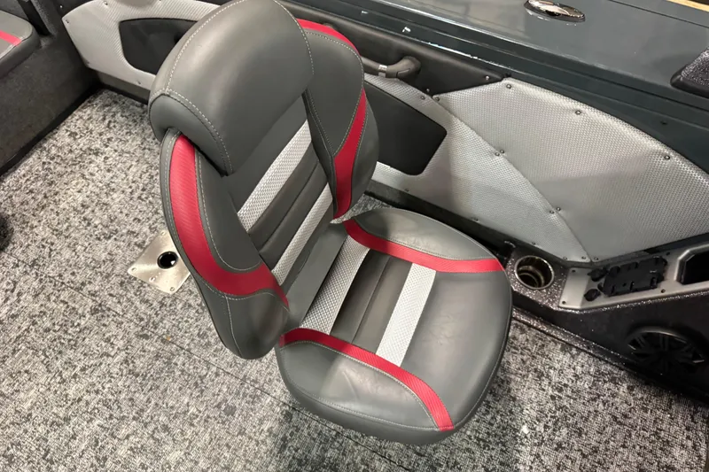 Slide: The Image of 2024 Ranger VX1888 WT boat seat with gray and red accents on textured flooring. - 9