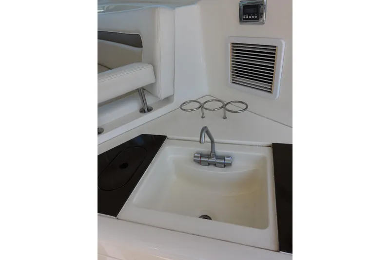 Slide: The Image of Interior view of 2012 Sea Ray Sundancer 540 yacht featuring a compact sink area. - 12