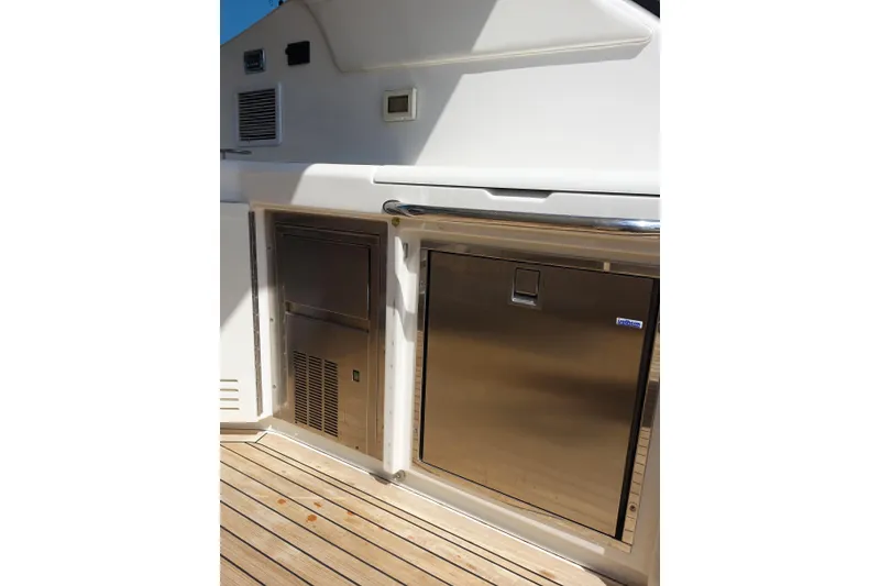Slide: The Image of Outdoor kitchen area on a 2012 Sea Ray Sundancer 540 yacht with stainless steel appliances. - 13