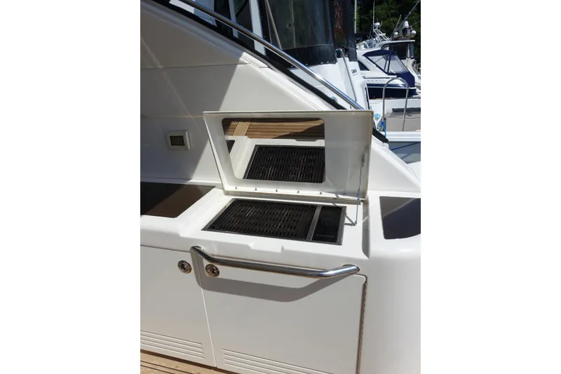 Slide: The Image of Outdoor grill on 2012 Sea Ray Sundancer 540 yacht, featuring sleek design and stainless steel finish. - 14