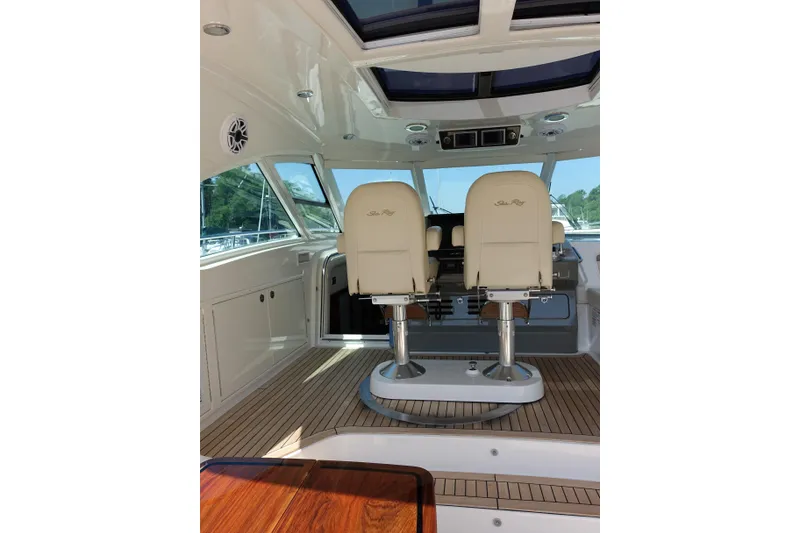 Slide: The Image of Interior of 2012 Sea Ray Sundancer 540 yacht with helm seats and teak flooring. - 18