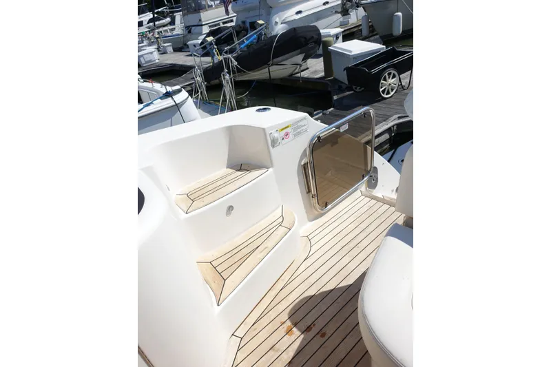 Slide: The Image of Steps and deck of a 2012 Sea Ray Sundancer 540 yacht at a marina. - 21