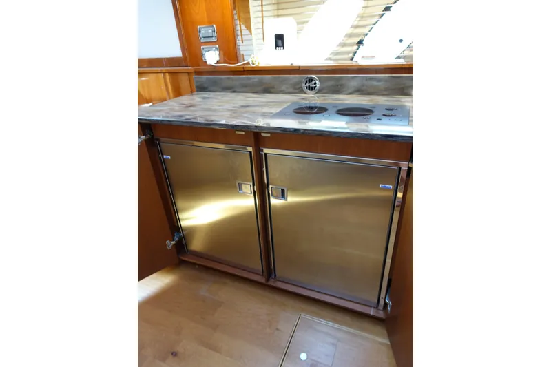Slide: The Image of Luxurious 2012 Sea Ray Sundancer 540 yacht kitchen with stainless steel appliances and sleek countertops. - 32