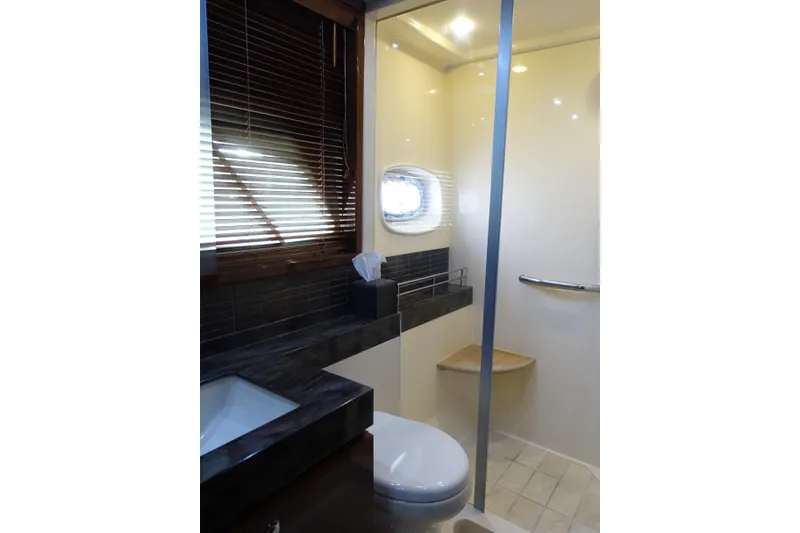 Slide: The Image of Luxurious bathroom in 2012 Sea Ray Sundancer 540 yacht with modern fixtures and window. - 35