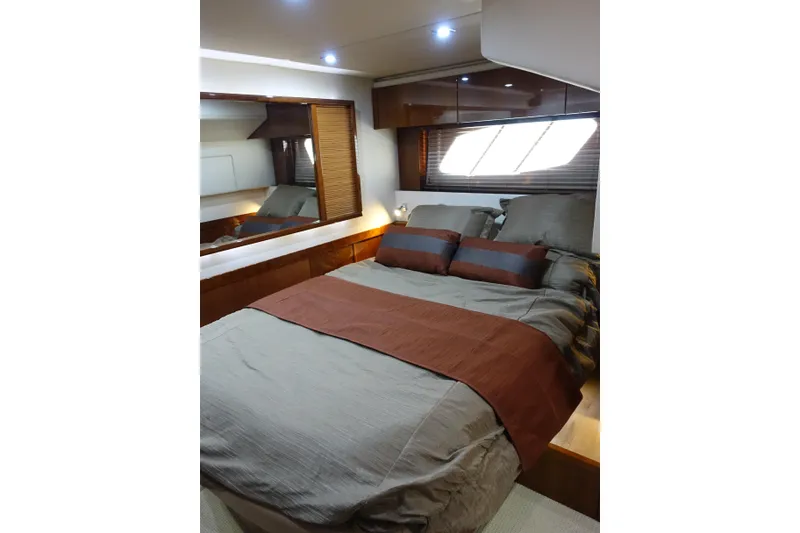 Slide: The Image of Luxurious bedroom interior of 2012 Sea Ray Sundancer 540 yacht with elegant bedding. - 38