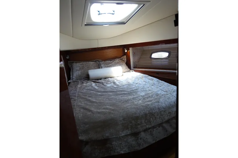 Slide: The Image of Luxurious bedroom interior of 2012 Sea Ray Sundancer 540 yacht with skylight and cozy bedding. - 40