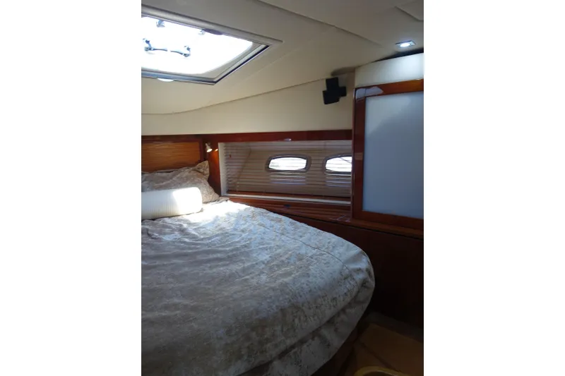 Slide: The Image of Luxurious cabin interior of 2012 Sea Ray Sundancer 540 yacht with cozy bedding. - 41