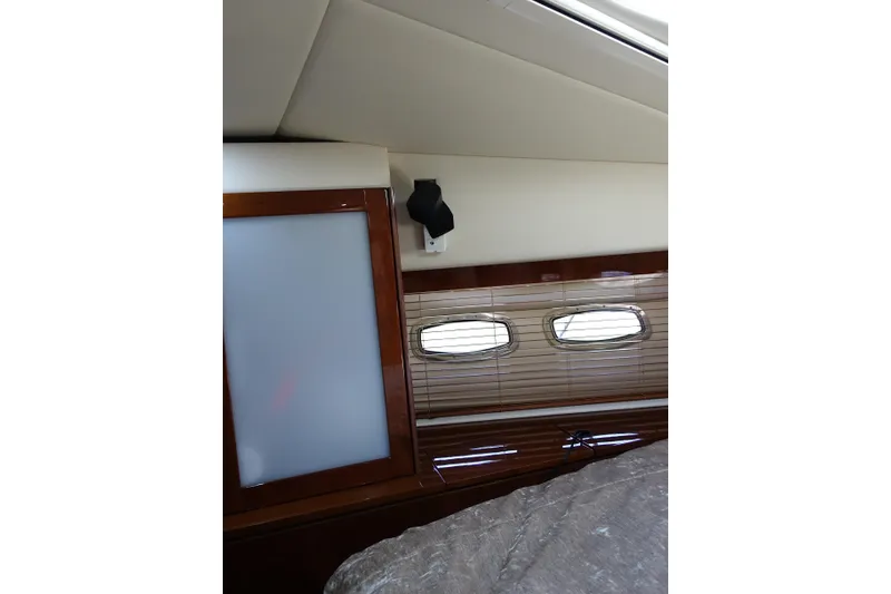 Slide: The Image of Interior of 2012 Sea Ray Sundancer 540 yacht with elegant wood paneling. - 42