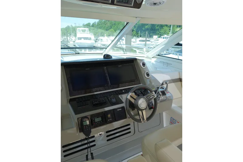 Slide: The Image of Helm of 2012 Sea Ray Sundancer 540 yacht with modern navigation controls. - 5