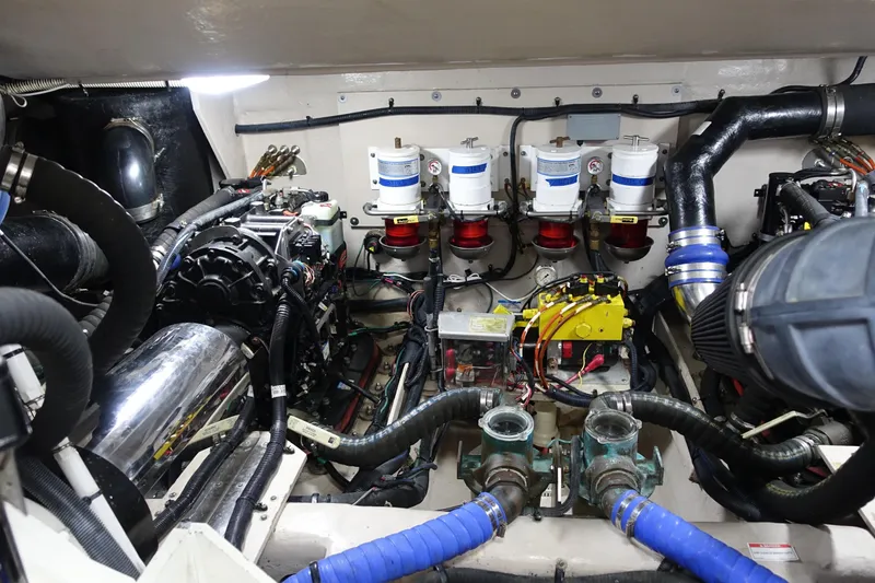 Slide: The Image of Engine room of 2012 Sea Ray Sundancer 540, showcasing complex machinery and components. - 51