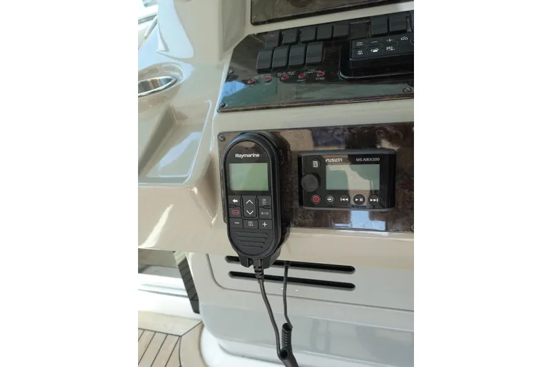 Slide: The Image of Control panel of a 2012 Sea Ray Sundancer 540 with Raymarine and Fusion MS-NRX300 devices. - 9