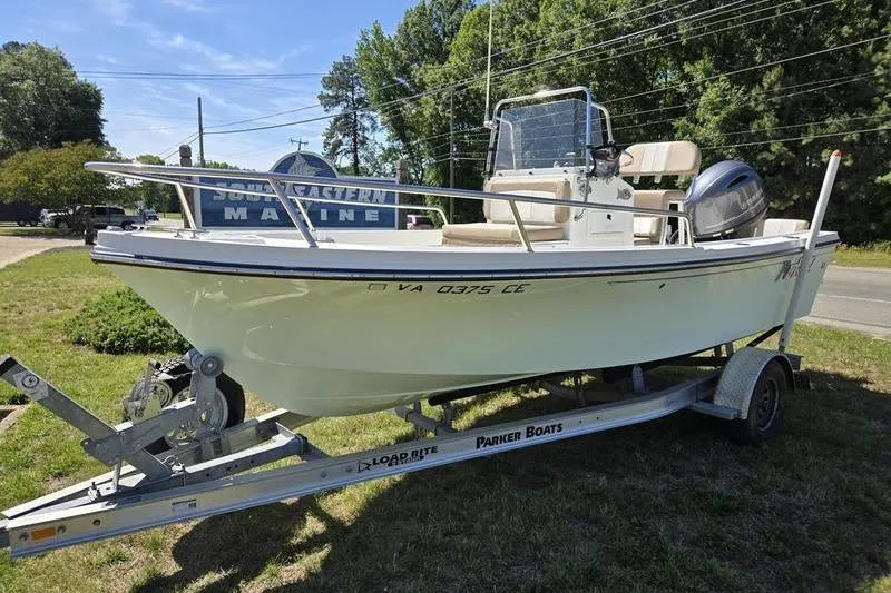 The Image of 2018 Parker 1801 Center Console boat on trailer, parked outdoors. - 0