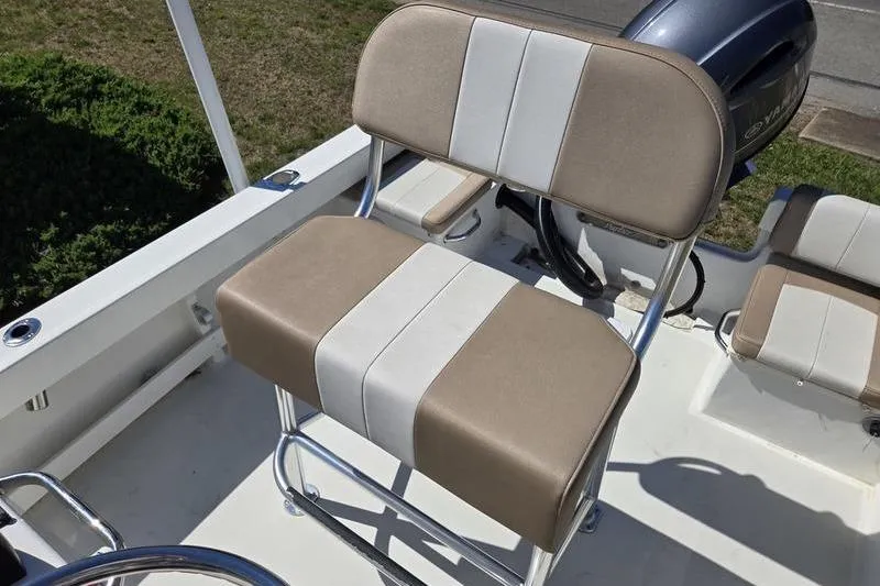 Slide: The Image of 2018 Parker 1801 Center Console boat seat with beige and white upholstery. - 1