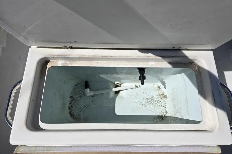 Slide: The Image of Open storage compartment on 2018 Parker 1801 Center Console boat. - 10