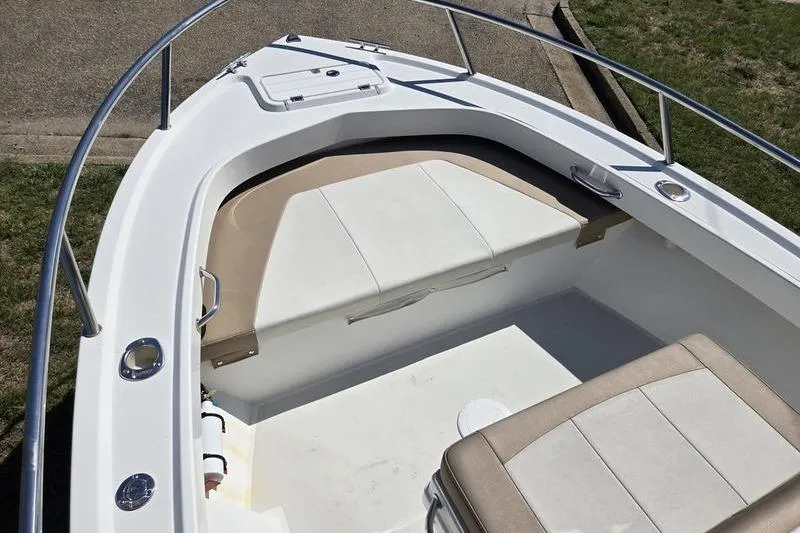 Slide: The Image of 2018 Parker 1801 Center Console boat interior with cushioned seating and storage. - 2