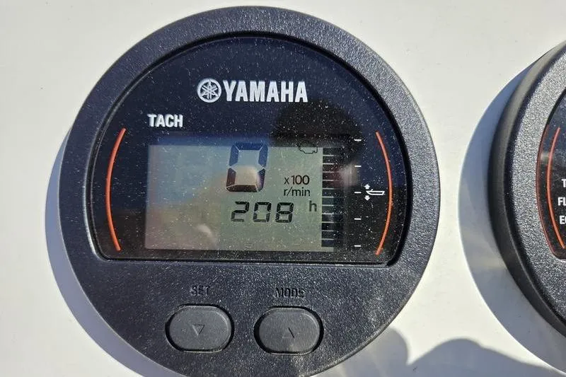 Slide: The Image of Yamaha tachometer displaying 208 hours on a Parker 1801 Center Console boat. - 5