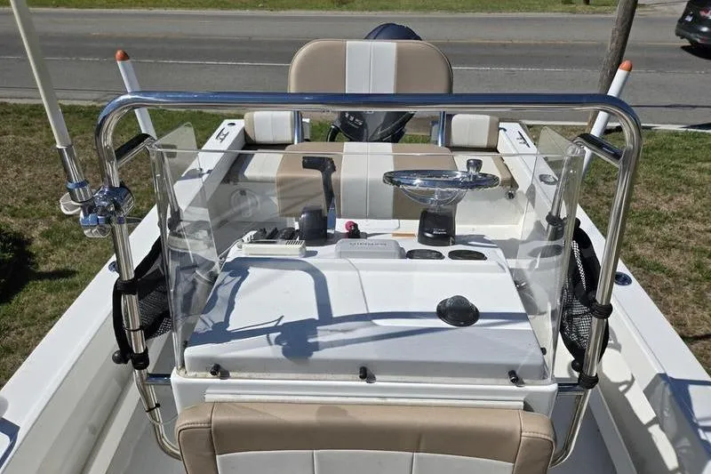 Slide: The Image of 2018 Parker 1801 Center Console boat with steering wheel and controls. - 7
