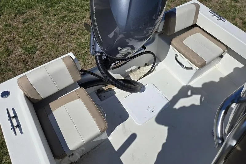 Slide: The Image of 2018 Parker 1801 Center Console boat interior with seating and engine view. - 8