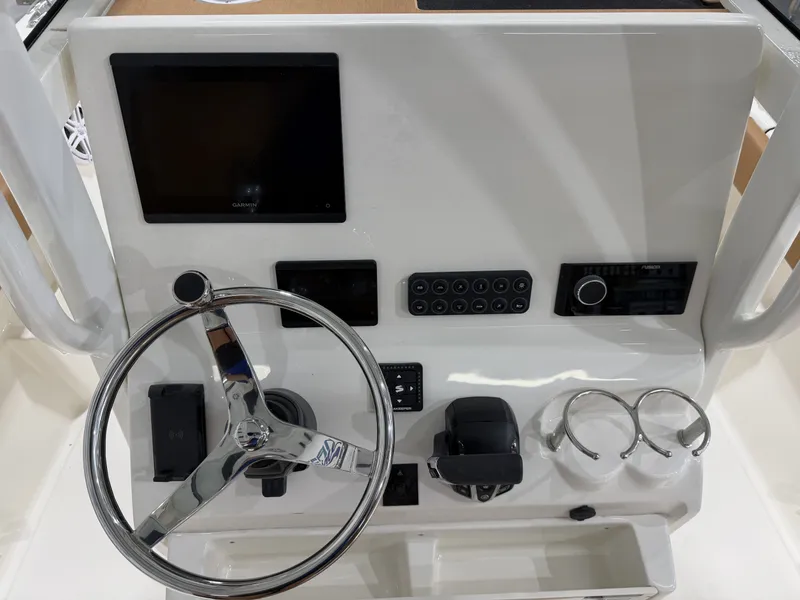 Slide: The Image of Key West 239 FSR 2026 helm with Garmin display and controls. - 20