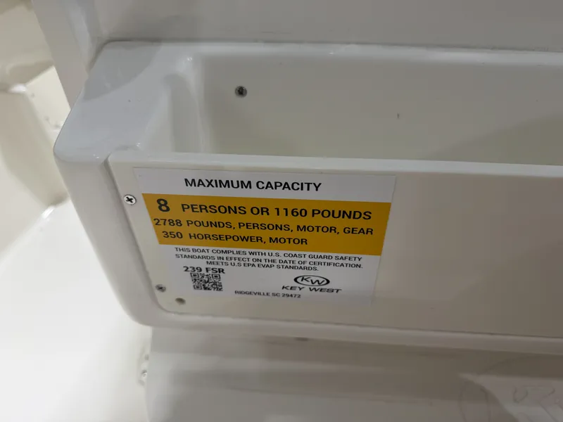 Slide: The Image of Key West 239 FSR boat capacity label, 8 persons, 350 horsepower, year 2026. - 23