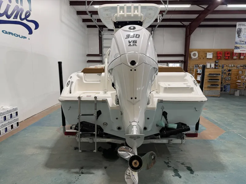 Slide: The Image of Rear view of a 2026 Key West 239 FSR boat in showroom. - 3