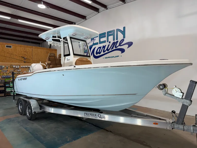 Slide: The Image of 2026 Key West 239 FSR boat on trailer in warehouse. - 9