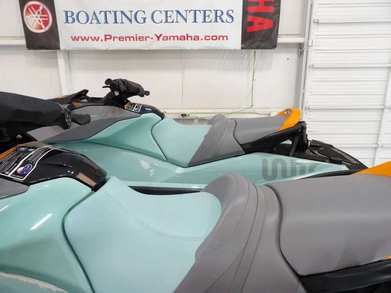 Slide: The Image of 2023 Sea-Doo Wake 170 jet ski in a boating center. - 19