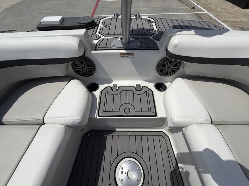 Slide: The Image of Interior of Starcraft SXV-211 boat, 2023 model, featuring seating area. - 25