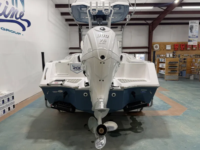 Slide: The Image of Rear view of 2026 Tidewater 232 CC Adventure boat in showroom. - 3