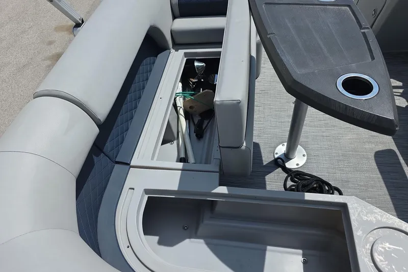 Slide: The Image of 2022 Bennington L 21 L-Bench boat interior with storage and table. - 10