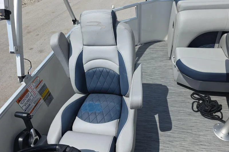 Slide: The Image of 2022 Bennington L 21 L-Bench boat interior with blue and gray seating. - 20