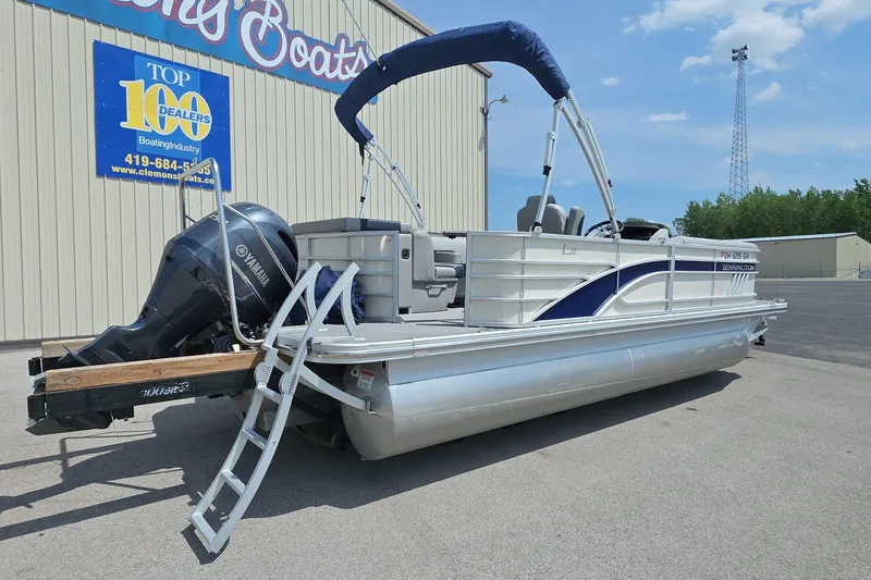 Slide: The Image of 2022 Bennington L 21 L-Bench pontoon boat with Yamaha engine at Clemons Boats dealership. - 3