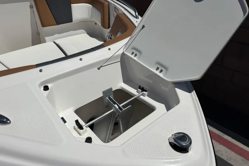 Slide: The Image of Open anchor storage compartment on 2023 Chaparral 23 SSi boat. - 12