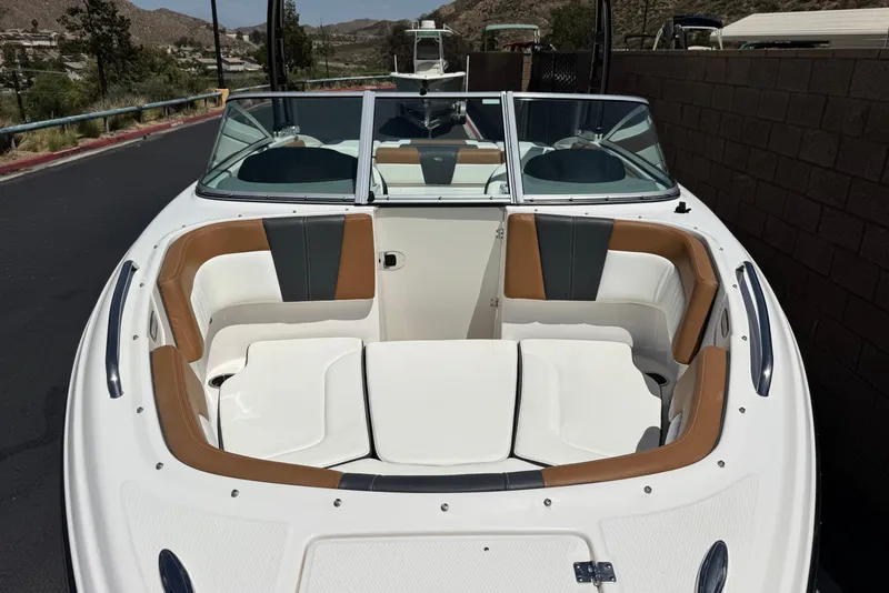 Slide: The Image of 2023 Chaparral 23 SSi boat with spacious seating and sleek design. - 13