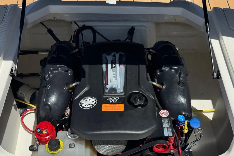 Slide: The Image of Engine compartment of 2023 Chaparral 23 SSi boat featuring a Volvo Penta 300 V8 engine. - 22