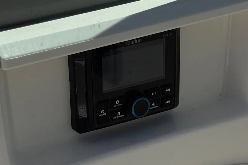 Slide: The Image of Clarion audio system in 2023 Chaparral 23 SSi boat dashboard. - 26