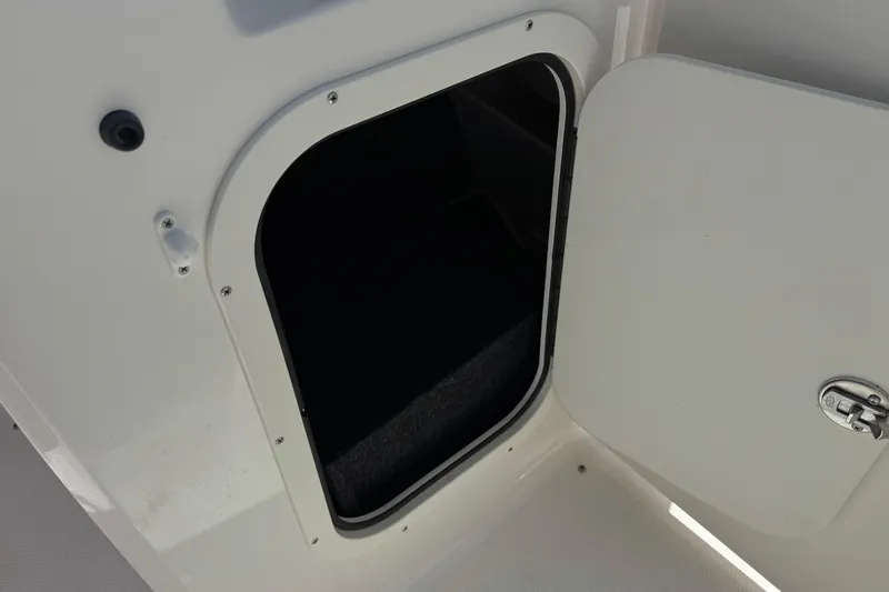 Slide: The Image of Open storage compartment on 2023 Chaparral 23 SSi boat. - 28