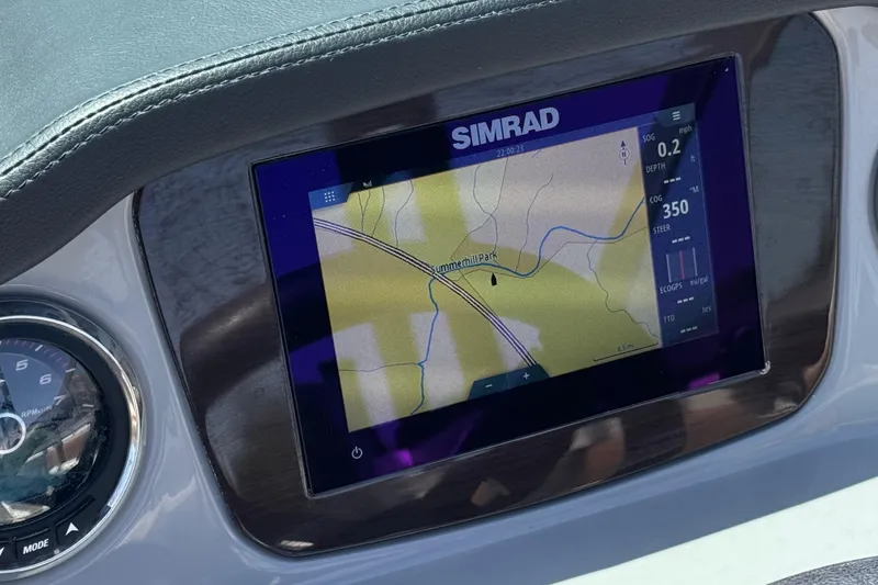 Slide: The Image of Simrad navigation display on 2023 Chaparral 23 SSi boat dashboard. - 31