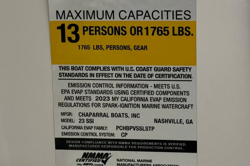 Slide: The Image of 2023 Chaparral 23 SSi capacity label: 13 persons or 1765 lbs, U.S. Coast Guard compliant. - 38