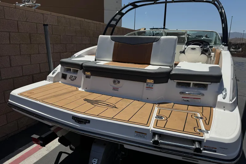 Slide: The Image of 2023 Chaparral 23 SSi boat with teak swim platform and stylish seating. - 7