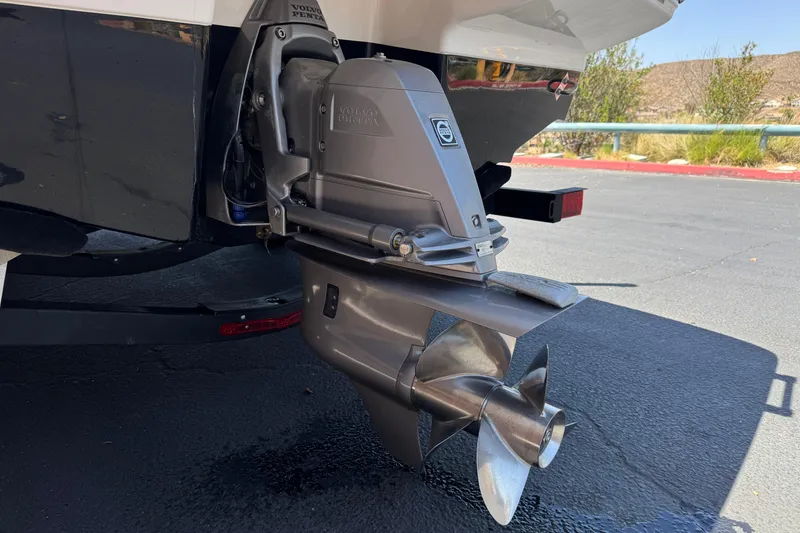 Slide: The Image of 2023 Chaparral 23 SSi boat with Volvo Penta outdrive, parked on pavement. - 9