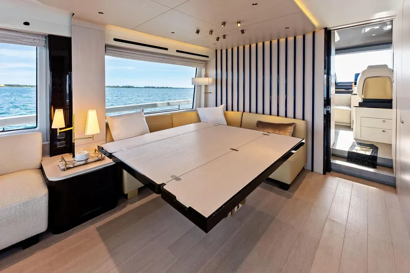 Slide: The Image of Luxurious interior of 2021 Azimut Fly 78 yacht with elegant dining area and scenic ocean view. - 18