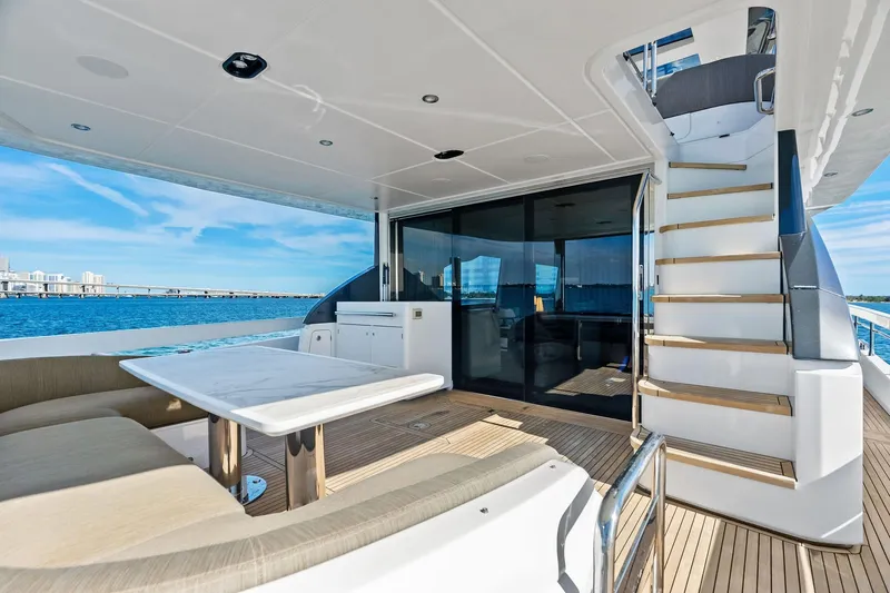 Slide: The Image of Luxurious 2021 Azimut Fly 78 yacht deck with seating, table, and ocean view. - 22