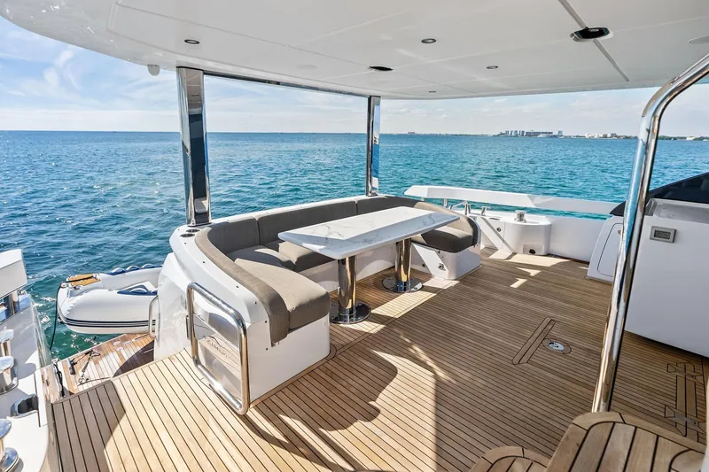 Slide: The Image of Luxurious 2021 Azimut Fly 78 yacht deck with elegant seating and ocean view. - 25