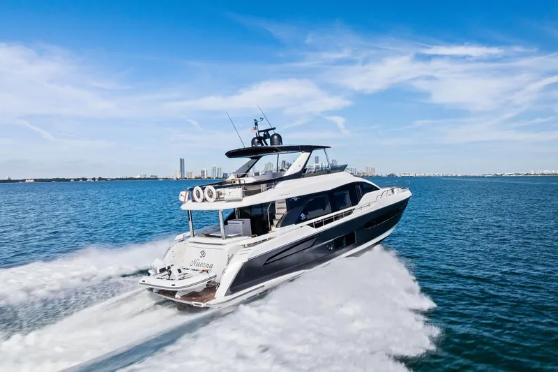 Slide: The Image of Azimut Fly 78 yacht cruising on open water, 2021 model, clear blue sky. - 70